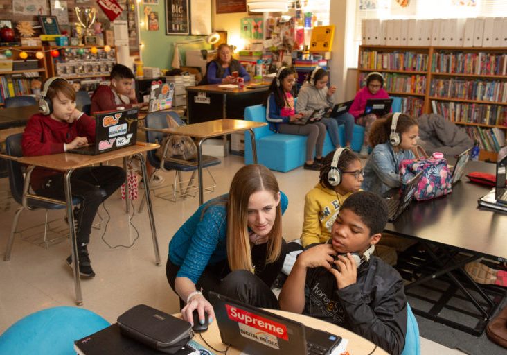 Students at Sutton Middle School compare and contrast songs representing different eras in history during an International Baccalaureate immersion day.